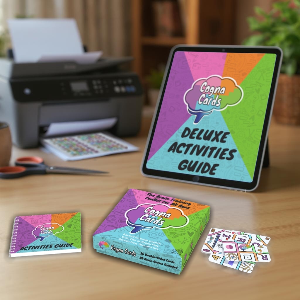 cognacards deluxe set showing printed box, activity manual, cards with digital deluxe manual and printer in background cognacards deluxe set showing printed box, activity manual, cards with digital deluxe manual and printer in background