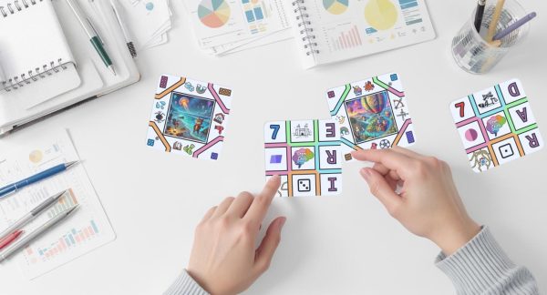 cognacards on a desk surrounded by research notes